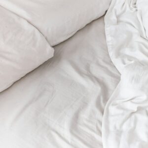 White cotton bed linen set with pillow and duvet