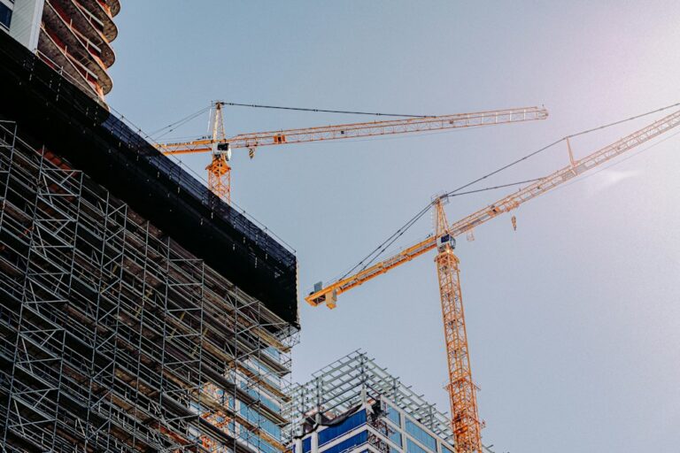 Tower cranes and scaffolding on a construction site
