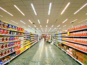 Grocery store aisle with fully stocked shelves