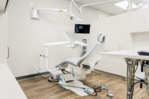 Bright clinic treatment room with a patient chair