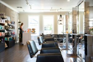 Beauty salon interior with a row of styling chairs