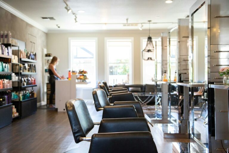 Beauty salon interior with a row of styling chairs