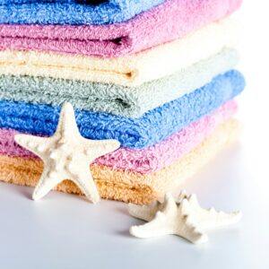Stack of folded bath towels in pastel colors