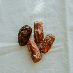 Plump Medjool dates on white linen