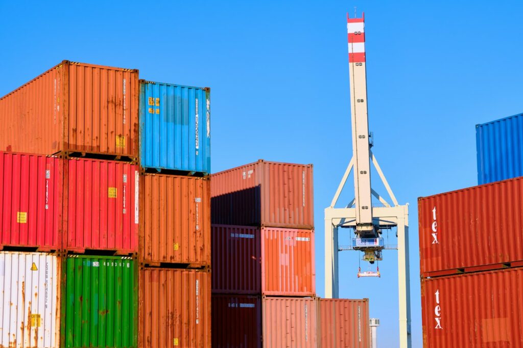 Stacked shipping containers with a port crane